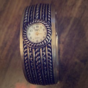 Vintage looking clamp bracelet with watch face